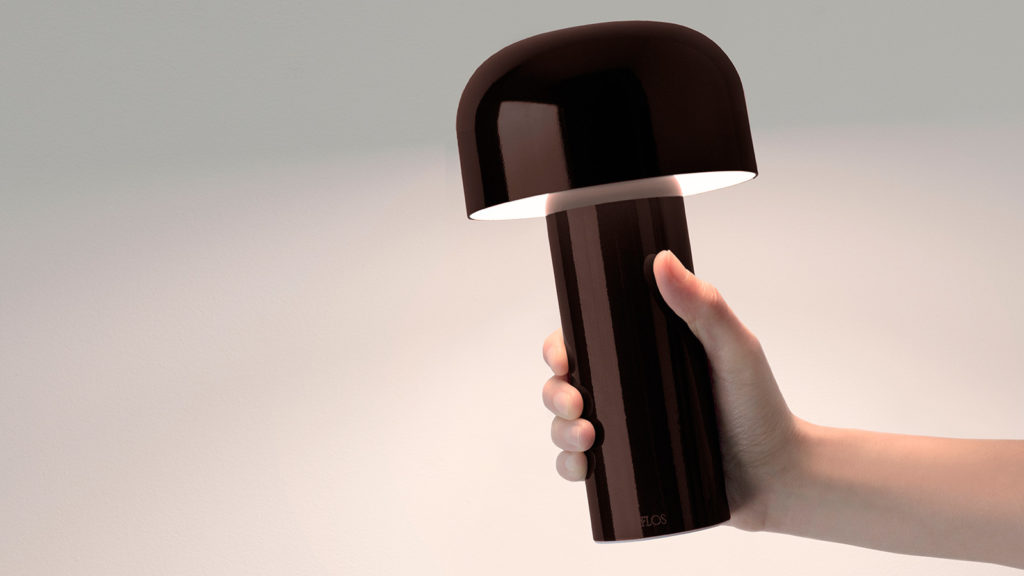Barber & Osgerby Bellhop Lamp dark brown being held in hand