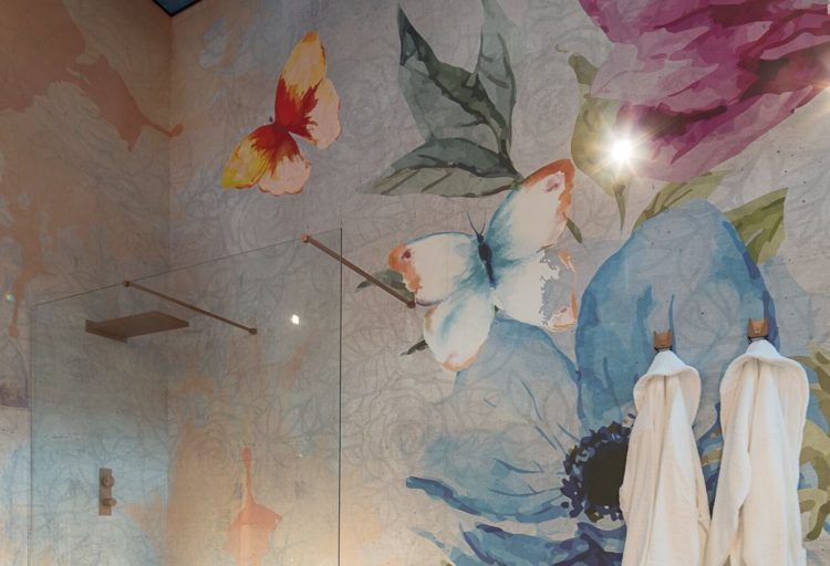 Instabilelab wallpaper custom inage with colorful butterflies on wall with upper part of glass shower enclosure in lower left