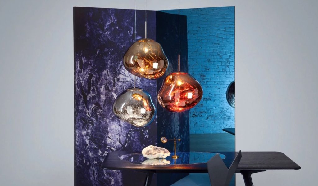 Tom Dixon Melt pendants 3 lights gold, silver, copper above wood table with background of ethereal partition screen