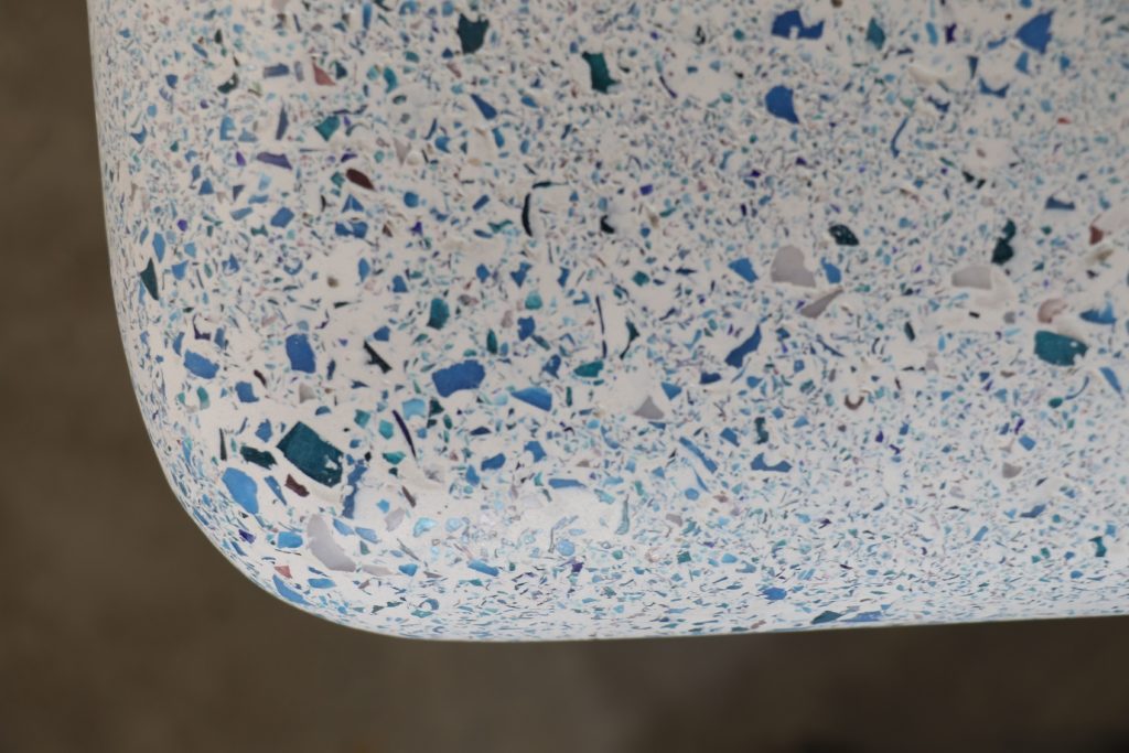 Zachary A. waterfall table with moonstone finish detail of table top
