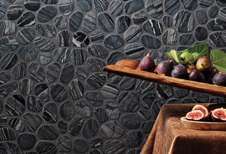 Ambiente Spindrift Marble on wall with plate of fruit in foreground