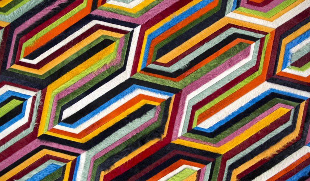 Kyle Bunting hide rugs flume design pentagon shapes and lines in multiple colors