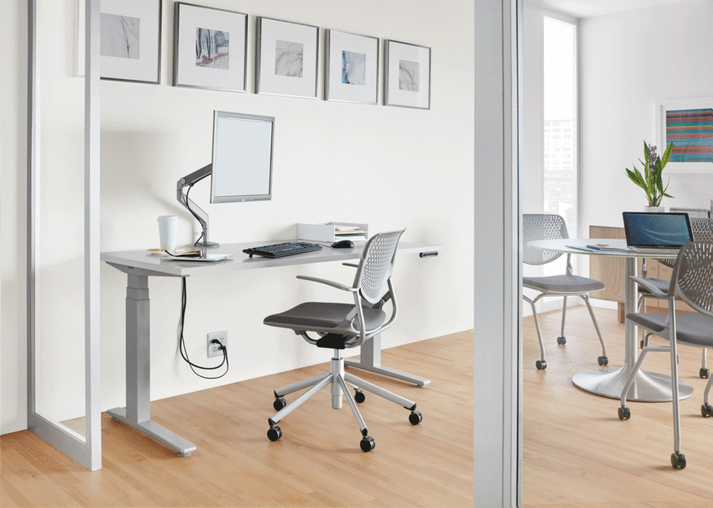 Room & Board Business Interiors SW Electric Desk inoffice with adjacent table and seating