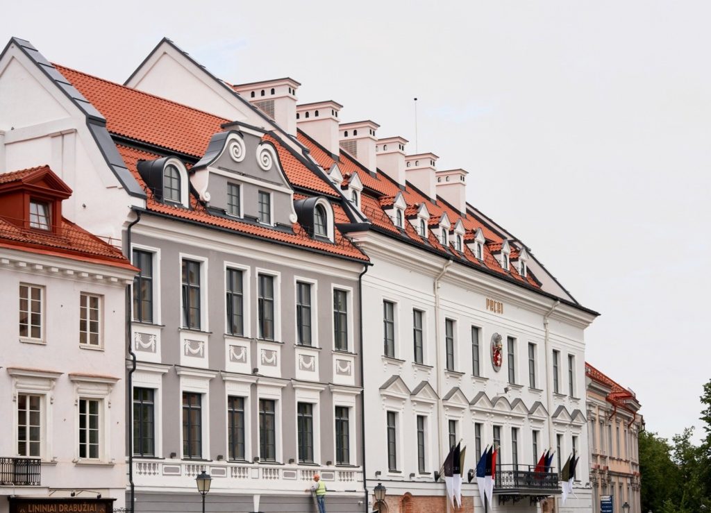 Hotel PACAI exterior red-tiled roof with many small dormers and white/gray exterior walls with lots of windows