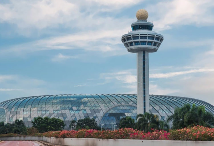 Vitro Architectural Glass in Jewel Changi Airport exterior view with tower and glass dome and landscaping in foreground