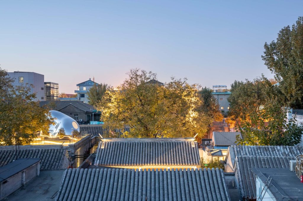 MAD Hutong Bubble 218 view of neighborhood rooftops including view of one bubble on Hutong 218