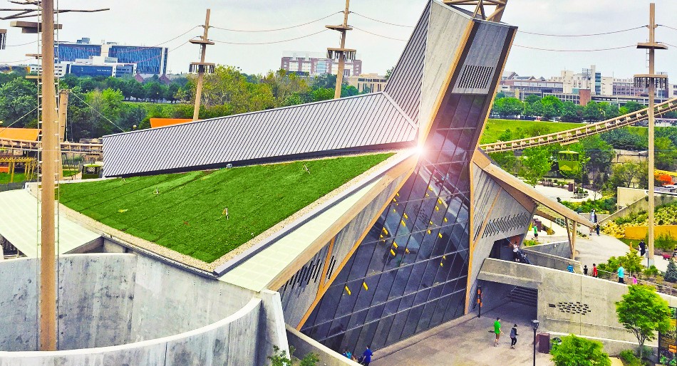 Hanging Gardens' Green Roofs Simon Skjodt Orangutan Center view showing slanted green roof on building with large glass facade