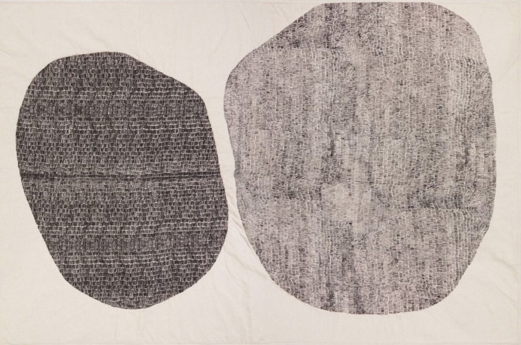 Tom Dixon Textiles Edit Stitch throw two asynchronous circular shapes in shades of gray on cream background