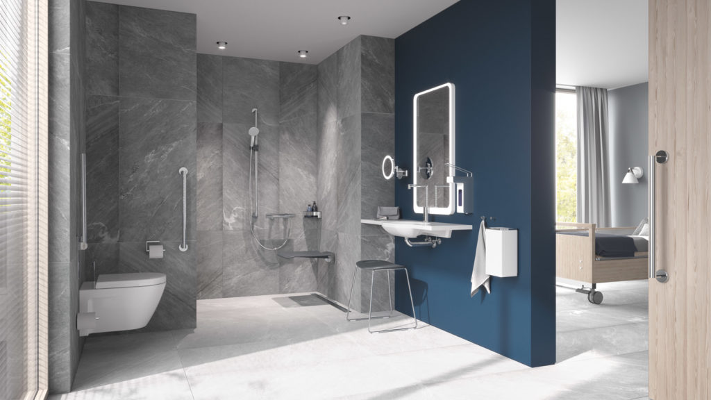 Hewi System 900 Support Rails in large bathroom with blue and gray walls and adjacent hospital room