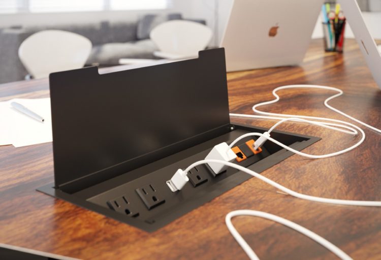 Mockett PCS91/USB Recessed Power Grommet black open with several devices plugged in on large wood conference table