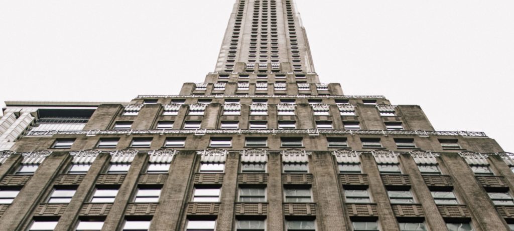 Rich Brilliant Willing view from below of original building at 70 Pine in New York