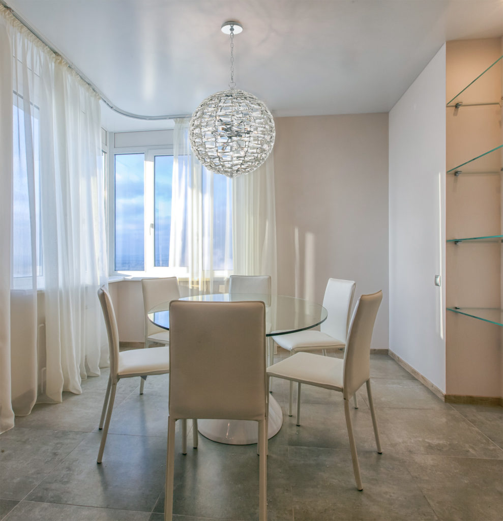 Allegri Crystal Alta Chandelier spherical shape made of rectangular crystal pieces with light fixture inside in spare dining room