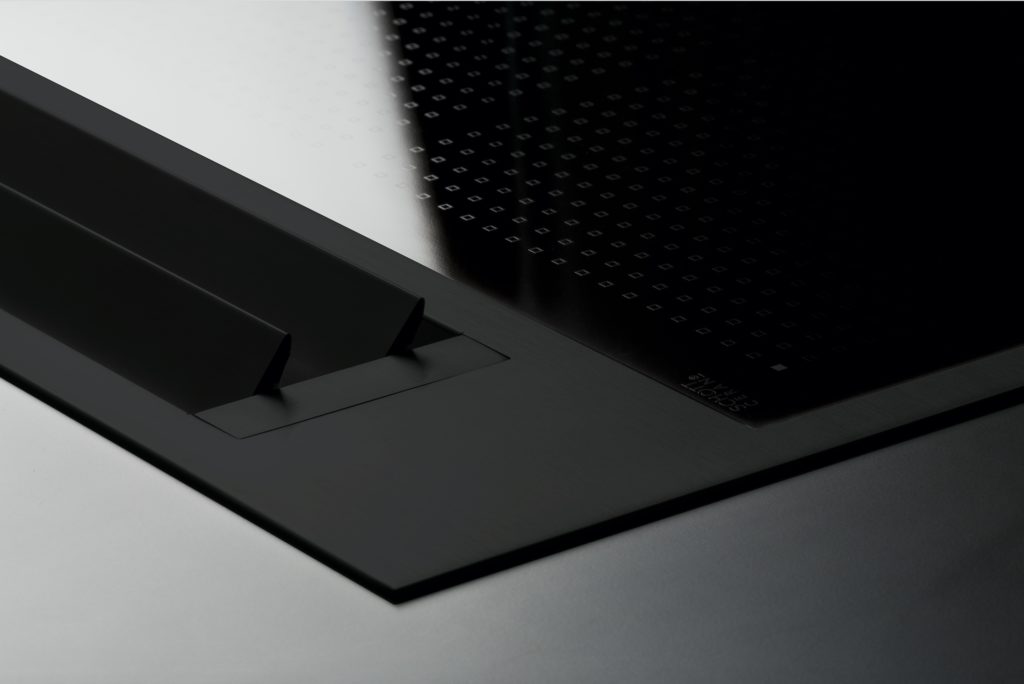 Sintesi total black cooktop detail of extraction feature with flaps up
