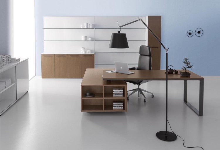 DVO Executive Office Planeta worktop and storage in wood veneer with large black floor lamp in foreground