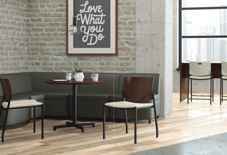 JSI Knox Seating in nook with cafe table in workspace chairs are dark wood laminate back with white upholstery