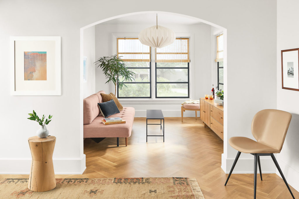 Room & Board Seating Gwen dining chair in taupe in hallway with seating room visible in background