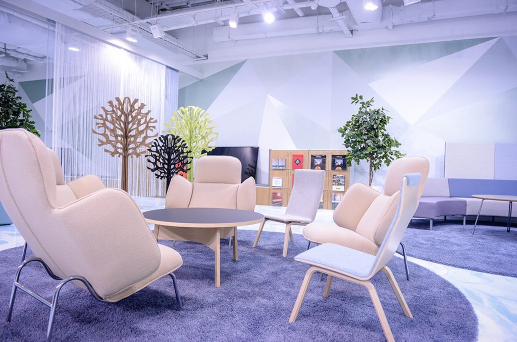 Unika Vaev Lovi Acoustic Trees all colors in nice sitting room with modern chairs and lavender carpet
