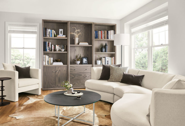 Room & Board Silva Chair in white in comfy modern living room with white curved sofa