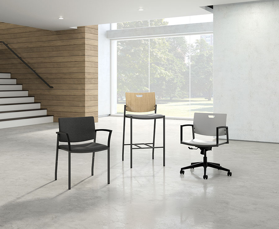 JSI Knox Seating three chairs of different heights with differing upholstery and back in open room with large window looking on green space