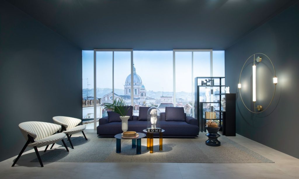 Zanotta's Oliva Chair off white, orange, black pattern two chairs in spacious room overlooking city
