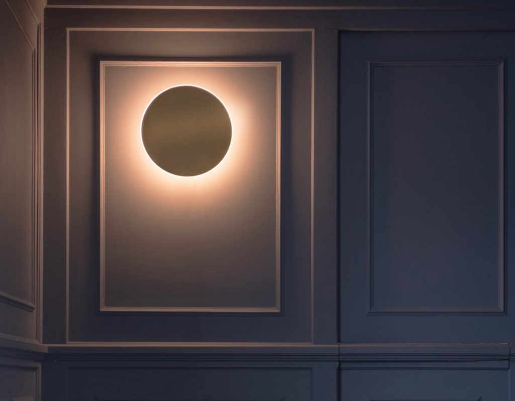 Ramen Wall Sconce on wall with moulding