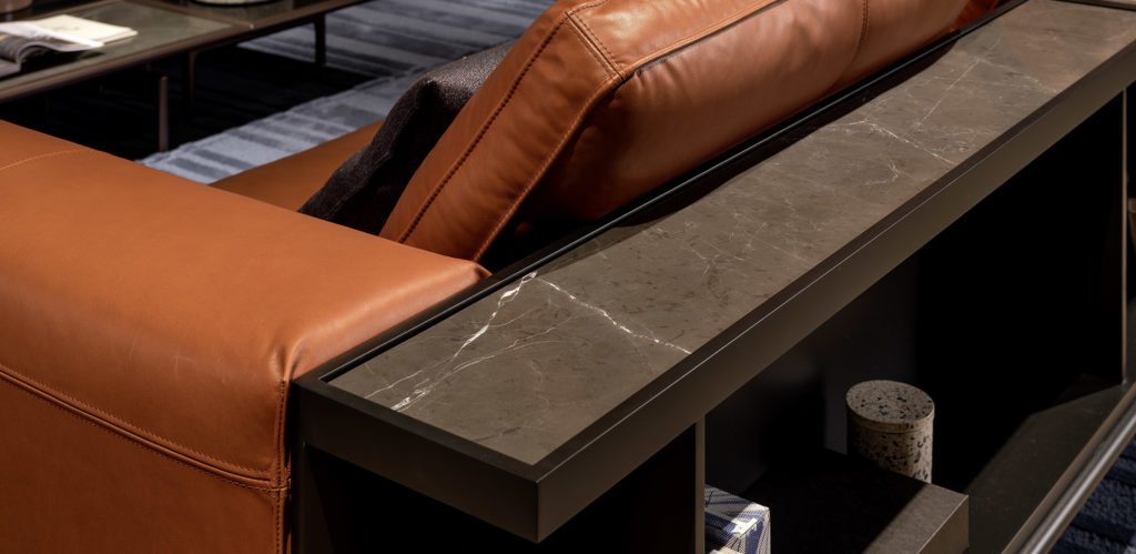 Rolf Benz Liv Sofa detail orange leather with marble shelving unit