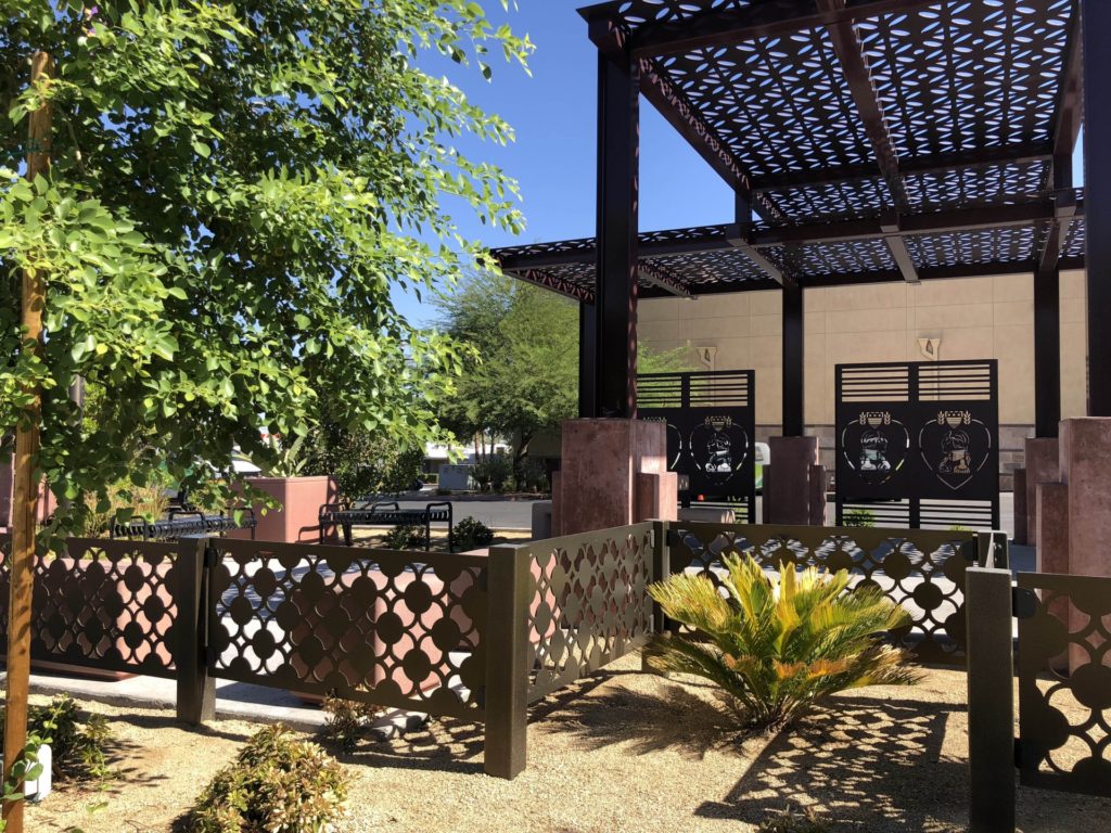 Parasoleil Purple Heart Plaza view of fencing, shade structure, and panels