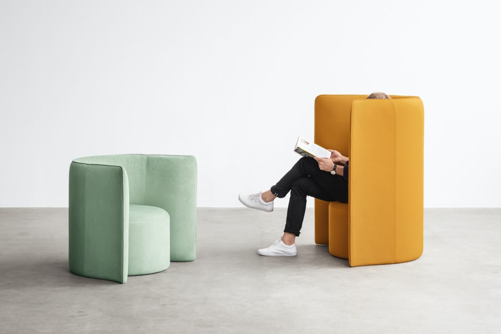 Hightower's Proto Lounge mint and yellow with partial view of seated woman