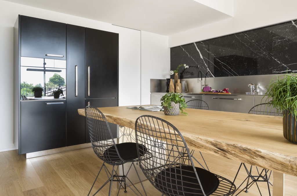 Atelier by Abimis table, tall units, worktop in background