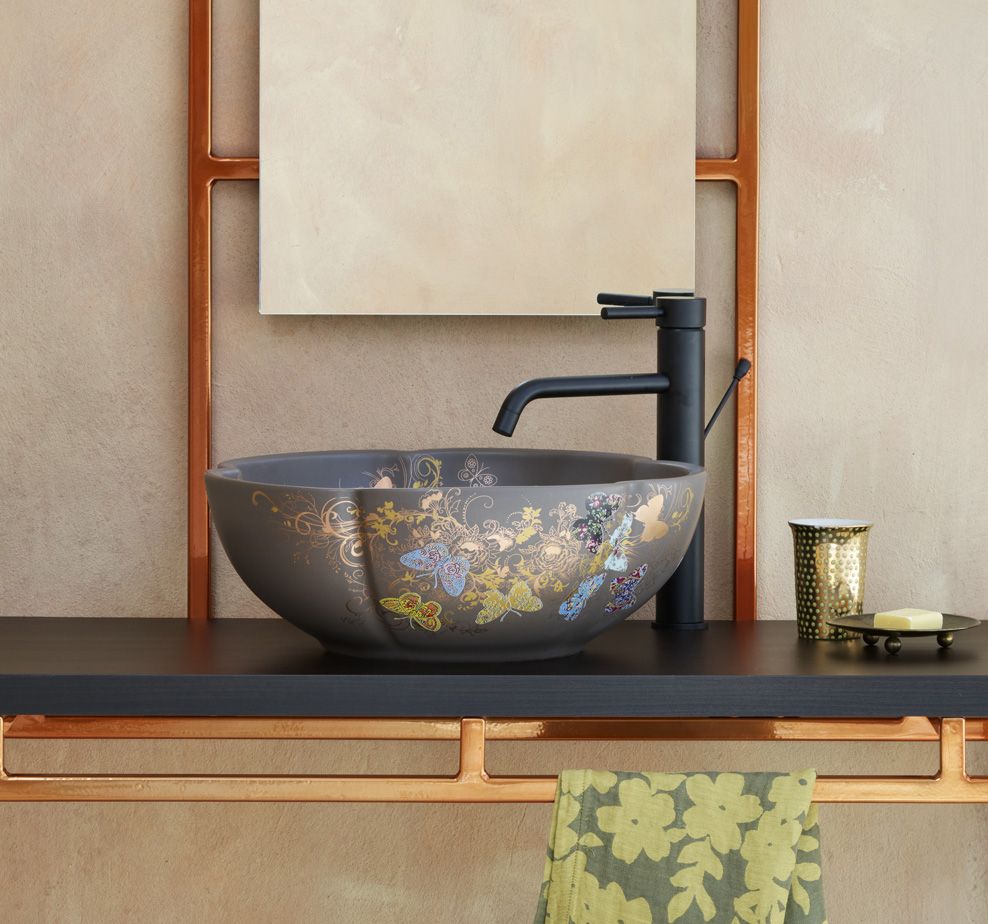 Zeina Washbasin dark on solid black vanity with copper details