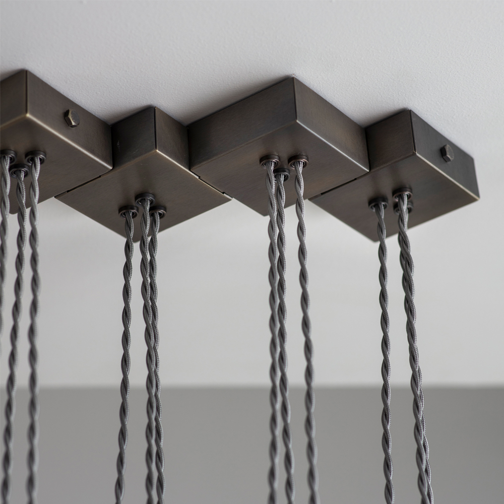 Tigermoth's Bronze Fold Linear Chandelier close up of mounting hardware and wire