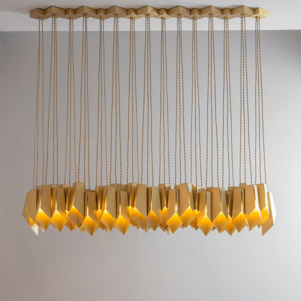 Tigermoth's Bronze Fold Linear Chandelier in brass