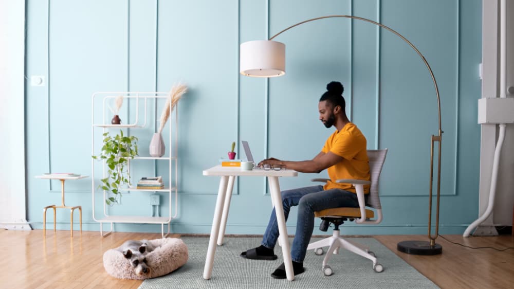 SitOnIt Reya Desk white on white with man working