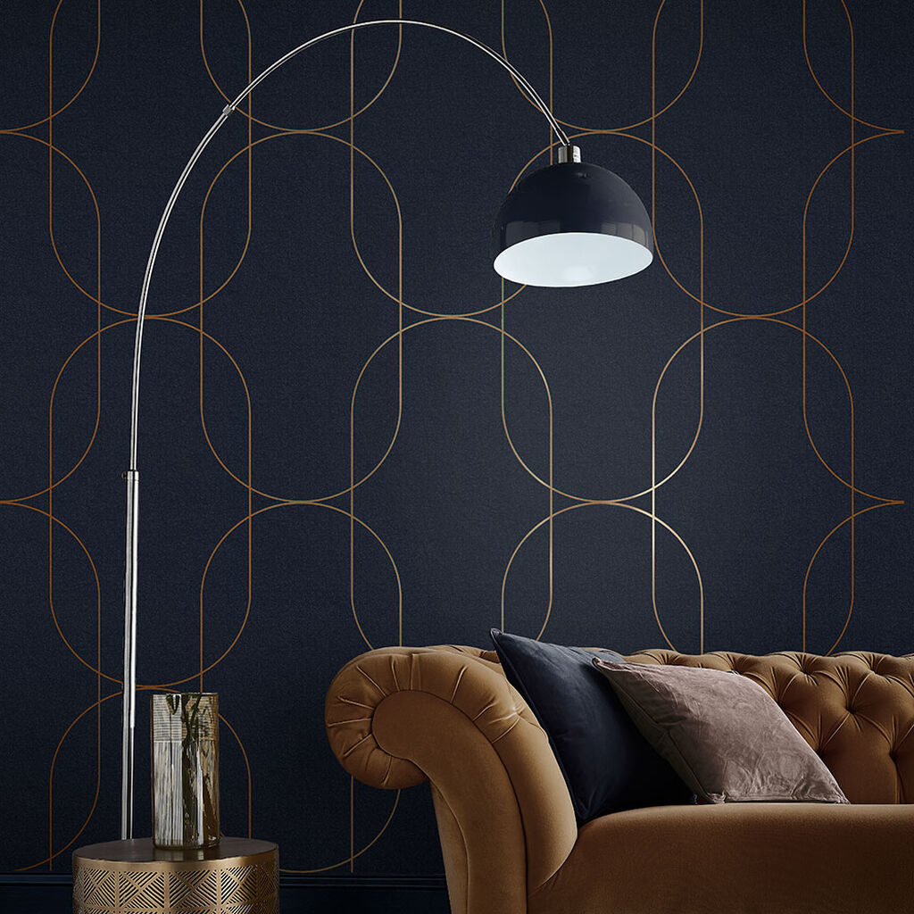 Graham & Brown Wallpaper Palais Navy/Gold with sofa in foregroung