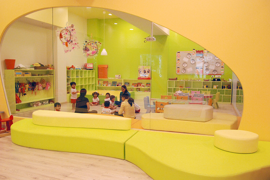 Play+ Furniture storage cubbies with kids in classroom