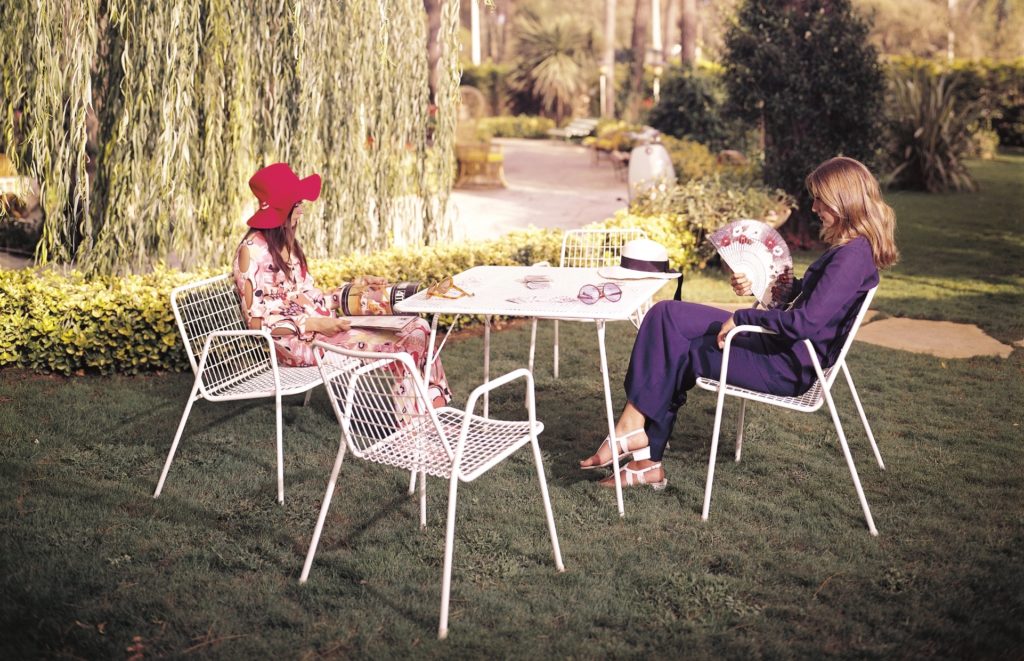 Emu Rio R50 white chairs on lawn