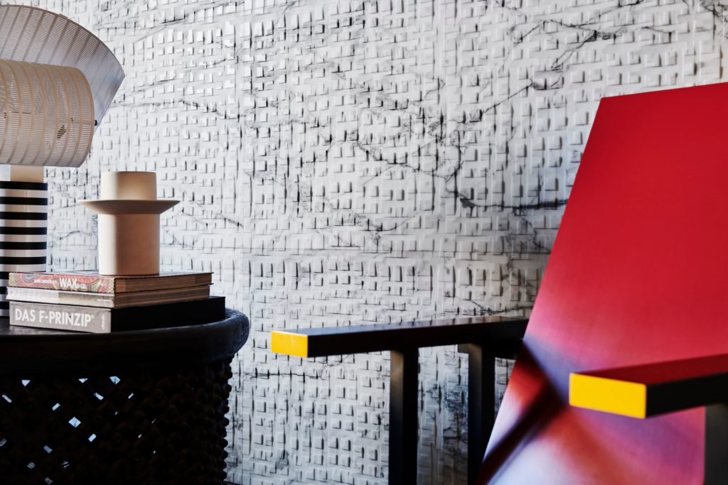 Polis Modular Marble in bedroom with partial view of red chair