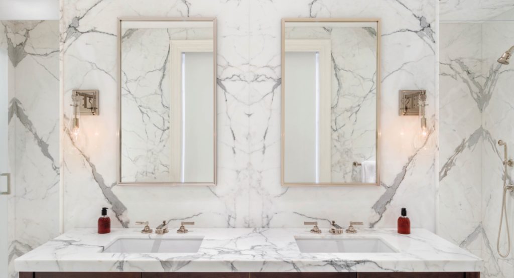 Bookmatched slabs in Calacatta Gold in bathroom