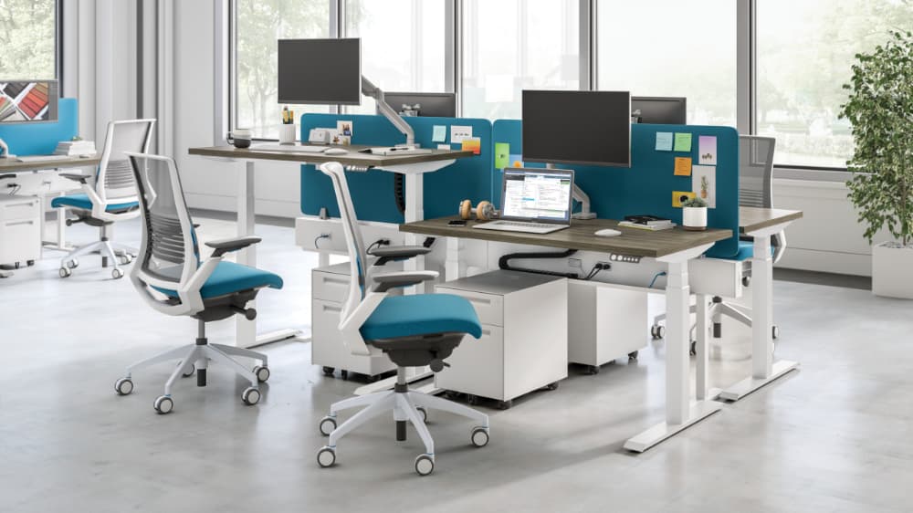 SitOnIt's eBEAM at combo workstation with different desk heights