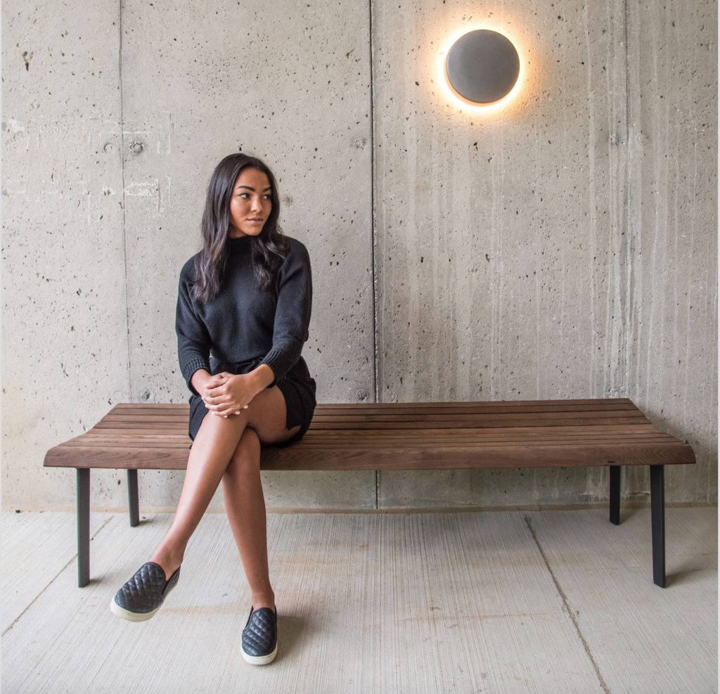 Motive Lighting wall mount on concrete wall with woman
