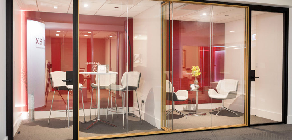 Muraflex Cuadro architectural glass partitions black anodized and walnut trim in office space double meeting room with dividing wall