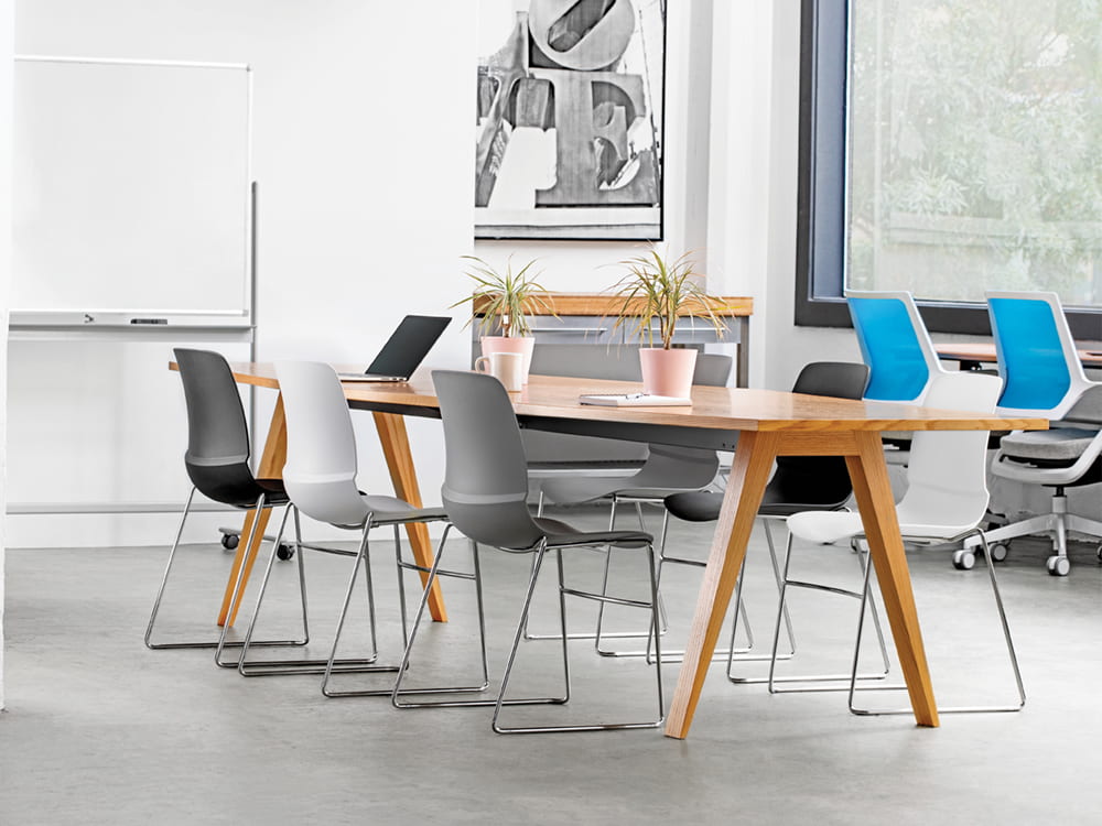 Mika Multi-Purpose chair in gray and white several chairs around conference table