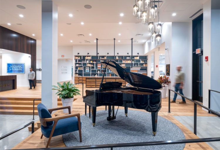 Kimball piano and Thatcher Lounge chair at the company's headquarters where they won the WELL Health and Safety seal
