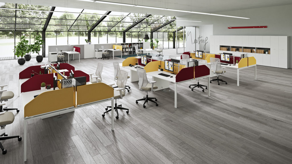 Vista Essence desks in white with red and yellow partitions in sunny office space