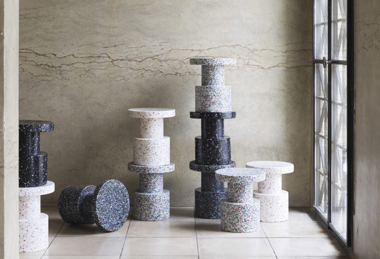Bit Stool several stools in different colors in room with tile floor