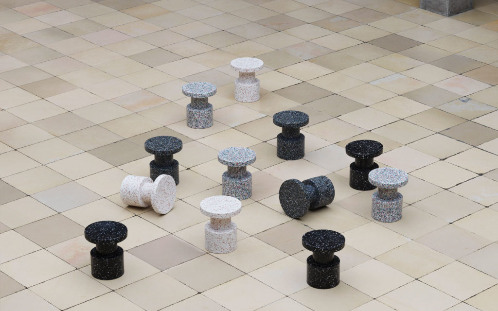 Bit stool many miniature stools on tile floor