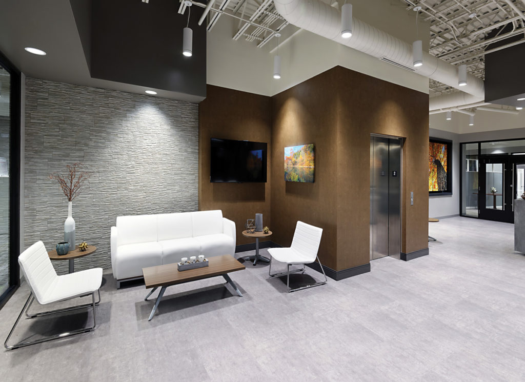Architectural Cylinders lights in nook near elevator in office
