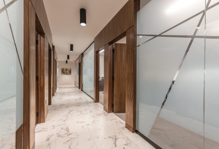 Architectural Cylinders black flush mount lights in office hallway