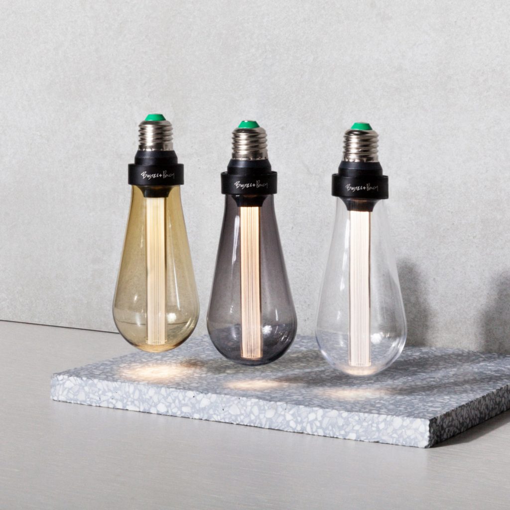 Buster Bulb three colors seemingly suspended over piece of terrazzo tile