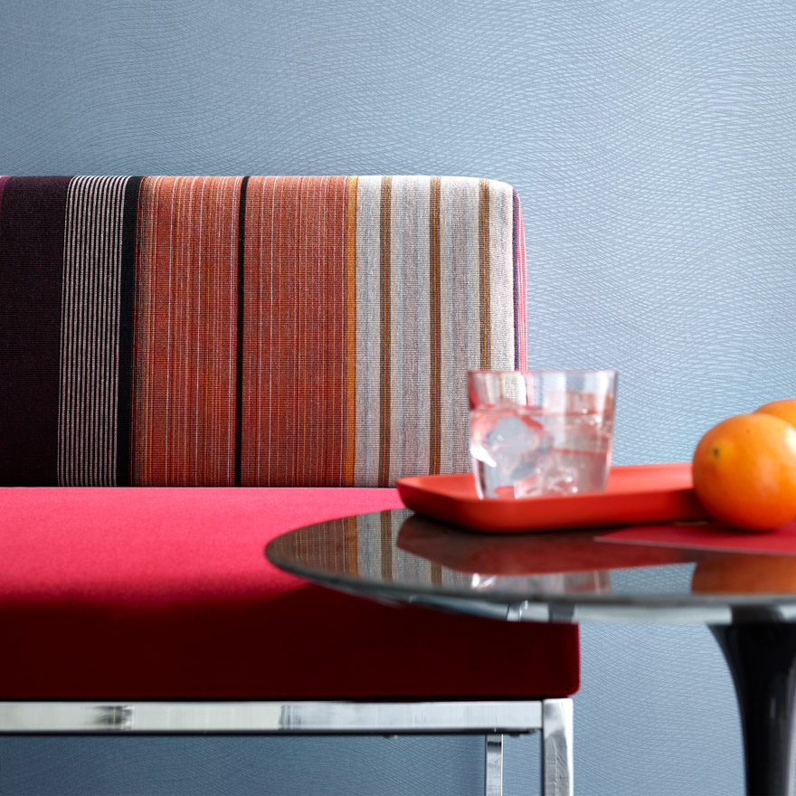 Stripe It on sofa reds, blues, oranges